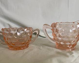 A Jeannette Glass Company "Cubist" pattern pink depression glass creamer and sugar bowl set. 
