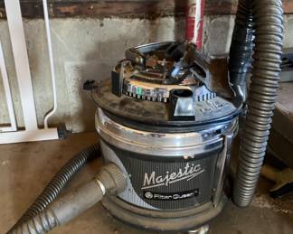 A Filter Queen Majestic canister vintage vacuum cleaner
