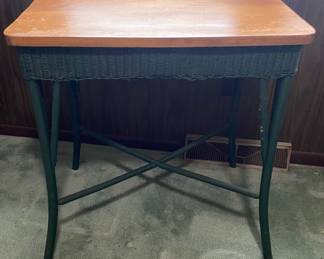 Small table with green wicker detail