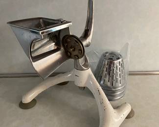 A vintage Rival Shred-O-Mat or Kitcheneer manual food grinder and salad maker. 

