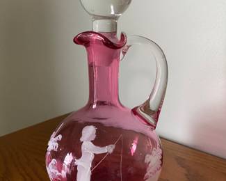  A vintage Mary Gregory cranberry glass cruet with a boy fishing
