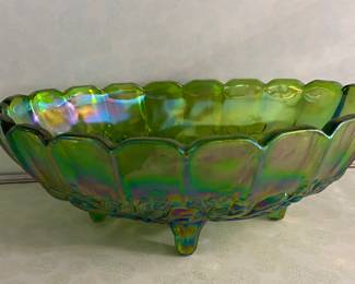 A vintage green iridescent Indiana Carnival Glass footed oval fruit bowl in the Harvest Grape pattern. 
