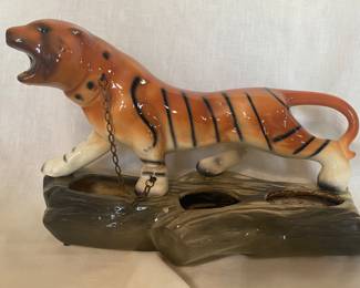 A mid-century ceramic tiger planter with chain