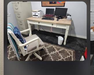 Small desk. Chair. Rug.