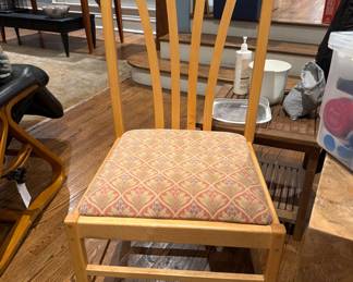 One of four Amish style wooden dowel chairs