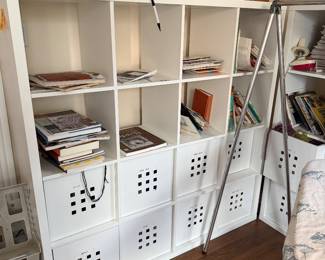 Shelf Units with storage on the bottom, storage areas filled with yarn