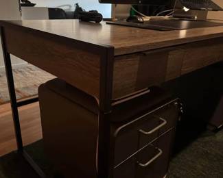 Only 1 year old - Large, modern writing desk - Sleek shape and timeless look - Black iron base - Keyboard tray - 3 Drawers with soft-close - Finished back - Functional and good looking - Solid Hardwood, Brown - Fits multiple monitors - No flaws or scuffs, in perfect condition Measurements = 30” tall 62” wide 30” deep - $450 + tax. Located in zipcode 60647
