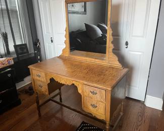 Dresser/Vanity with 4 drawers and attached mirror. Mirror frame is 24"x32", glass panel is 21"x25". All 4 drawers function properly size: 43.5" W x 20.25" D x 30.25" H