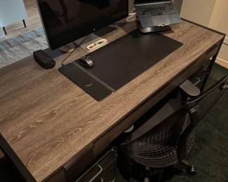 Only 1 year old - Large, modern writing desk - Sleek shape and timeless look - Black iron base - Keyboard tray - 3 Drawers with soft-close - Finished back - Functional and good looking - Solid Hardwood, Brown - Fits multiple monitors - No flaws or scuffs, in perfect condition Measurements = 30” tall 62” wide 30” deep - $450 + tax. Located in zipcode 60647
