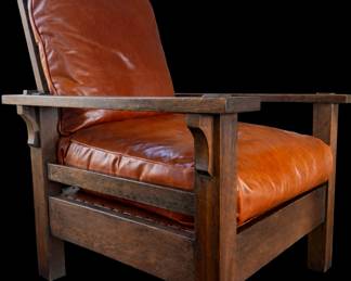 L&JG Stickley Onondaga Morris Chair, c. 1904. Solid quarter-sawn oak with original fumed finish, through tenon construction, and wide flat arms. Classic Arts & Crafts form with rich leather cushions. An iconic early Stickley example, combining honest craftsmanship with timeless mission design.
In this context, Onondaga refers to one of the early model names used by L. & J.G. Stickley for their Morris chairs around 1903–1905.
Stickley often named furniture forms after Native American tribes or regions (Onondaga is one of the nations of the Haudenosaunee/Iroquois Confederacy, based in upstate New York). The name signified strength, regional identity, and an American design ethos—aligning with the Arts & Crafts movement’s emphasis on honest craftsmanship and indigenous inspiration.
For collectors, “Onondaga” helps date and identify an early production Morris chair form from the Syracuse-era catalogs.