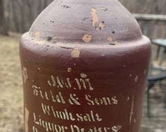 Authentic antique stoneware whiskey jug advertising J.W.M. Field & Sons, wholesale liquor dealers of Owensboro, Kentucky. This classic jug features stenciled lettering on a rich brown glaze, with a darker glazed collar at the neck and strong, well-balanced form.
Owensboro was a significant center for Kentucky’s whiskey trade in the late 19th and early 20th centuries, and stenciled stoneware jugs like this were commonly produced for regional liquor wholesalers. The surviving stencil remains legible and visually strong, enhanced by honest surface wear acquired over decades of use.