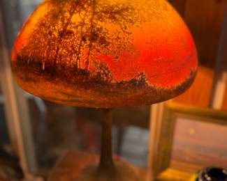 Handel reverse-painted “Sunset” table lamp — glowing landscape shade with rich amber and crimson tones on original metal base. A standout Arts & Crafts lighting piece offering warmth, atmosphere, and collector appeal. Available at our upcoming estate sale — exceptional early American design.
