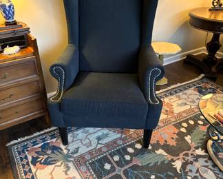 There are two of these high-end navy wingbacks!