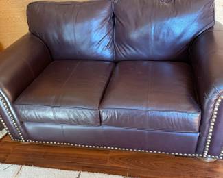 #58 - $200 - Leatherette brown loveseat 