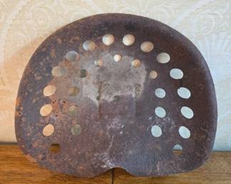 	Rusty Metal Tractor Seat