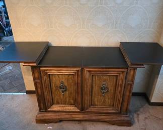 	Wooden Cabinet With Expandable Surface