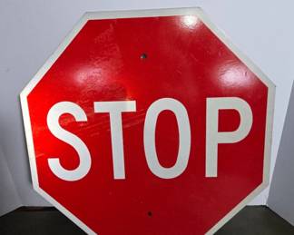 Metal Stop Sign with Red Background
