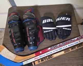 Hockey Equipment Including Gloves and Sticks