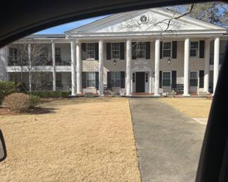 Front of the building where everyone will enter and take the elevator to the second floor. 