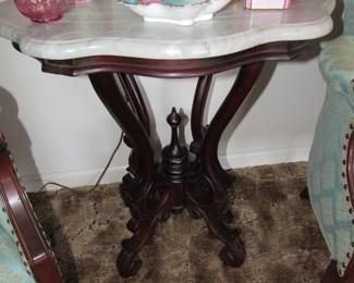 There are 2 of these marble top tables.
