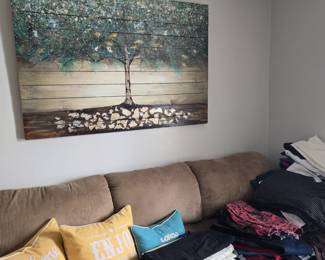 This sofa is loaded down with mostly pants and leggings.