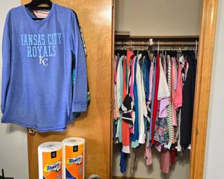 This bedroom is at the end of the hallway when you turn left and go up a few steps. More and more clothing.