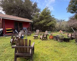 Outdoor wood and iron furniture, pot plants