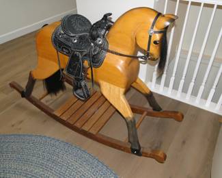 Solid wood and hand carved.  One of the last Jackie Wilson rocking horse, ever made.  Wooden and hand carved, with real horse hair tail