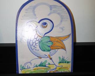 A very nice one of a kind piece of pottery, happily at home on a shelf or on a wall