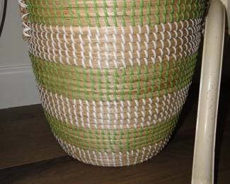 This tall handmade basket is filled with.........
