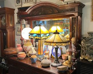 Pretty antique buffet with carved top & sides, beveled mirror and decorative columns