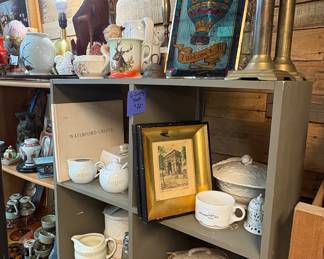 framed prints, brass candle sconces, 