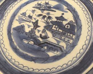 Chinese export porcelain plate in the Canton blue and white pattern. 
