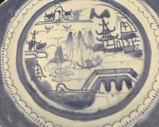 Chinese export porcelain plate in the Canton blue and white pattern. 
