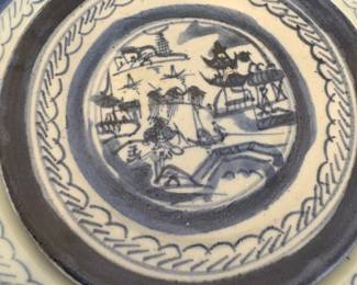 Chinese export porcelain plate in the Canton blue and white pattern. 
