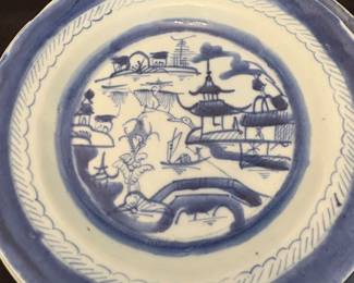 Chinese export porcelain plate in the Canton blue and white pattern. 
