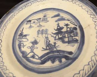 Chinese export porcelain plate in the Canton blue and white pattern. 
