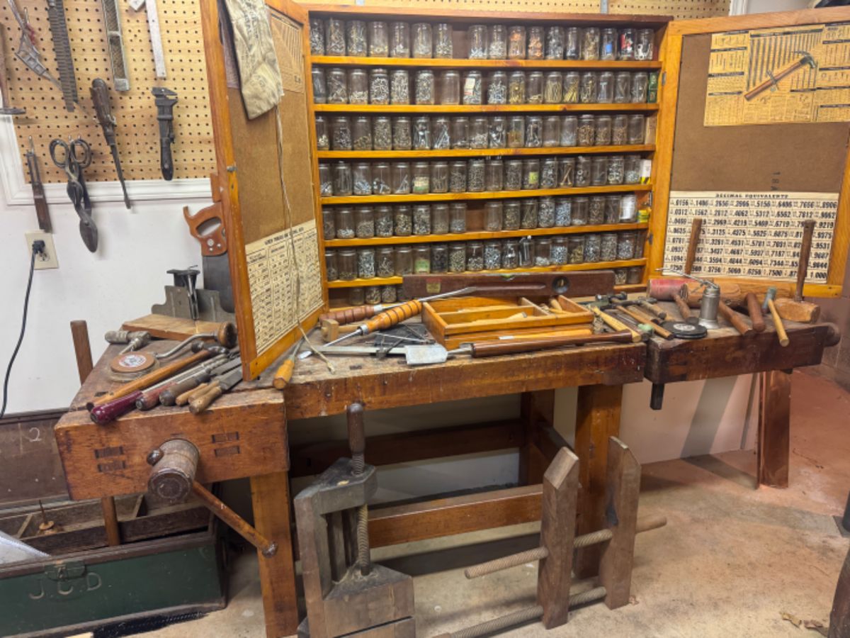 Vintage carpenter work bench, tools, and vintage cabinet,