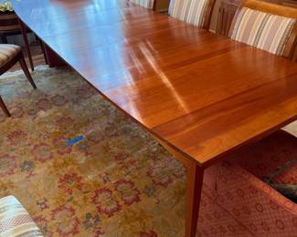 Dining Table by Harden  has three 16" leaves, 42" wide x 66" long without leaves Can be opened 115" long and has Custom Pads
