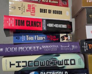 Collection of Tom Clancy and other authors hardcover books