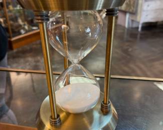 vintage brass hourglass with white sand 