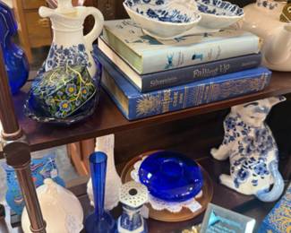 lots of blue and blue and white, cat figurines, books and more