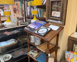 wooden lectern, framed art, coffee table books