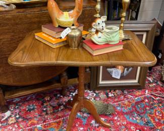small solid wood vintage drop leaf table, cute dog planter, large brass candlesticks, vintage books
