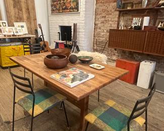 Iron chairs in Oak Trestle table
