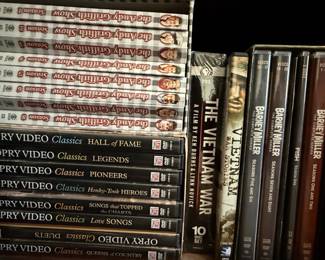 Collection of DVDs including Documentaries, TV Series, and Fitness Programs