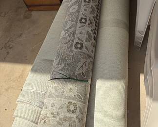 Rolled Rugs with Floral and Geometric Patterns