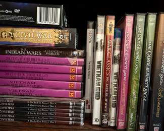 Collection of DVDs including Documentaries, TV Series, and Fitness Programs