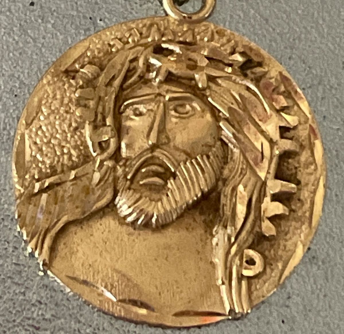 Gold medallion of Jesus