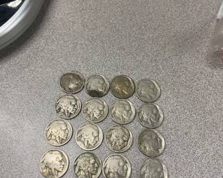 Several groups of buffalo nickels